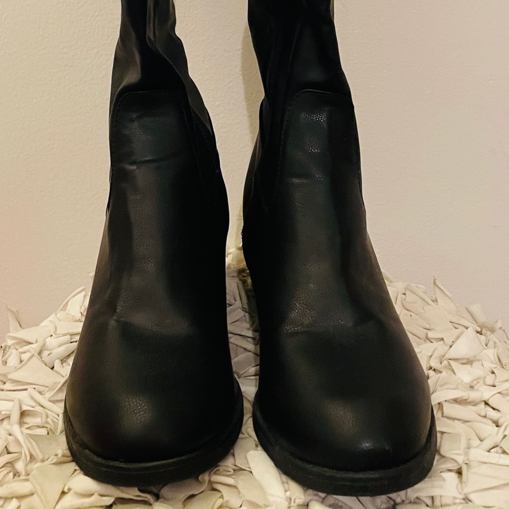 Women’s black thigh high boots